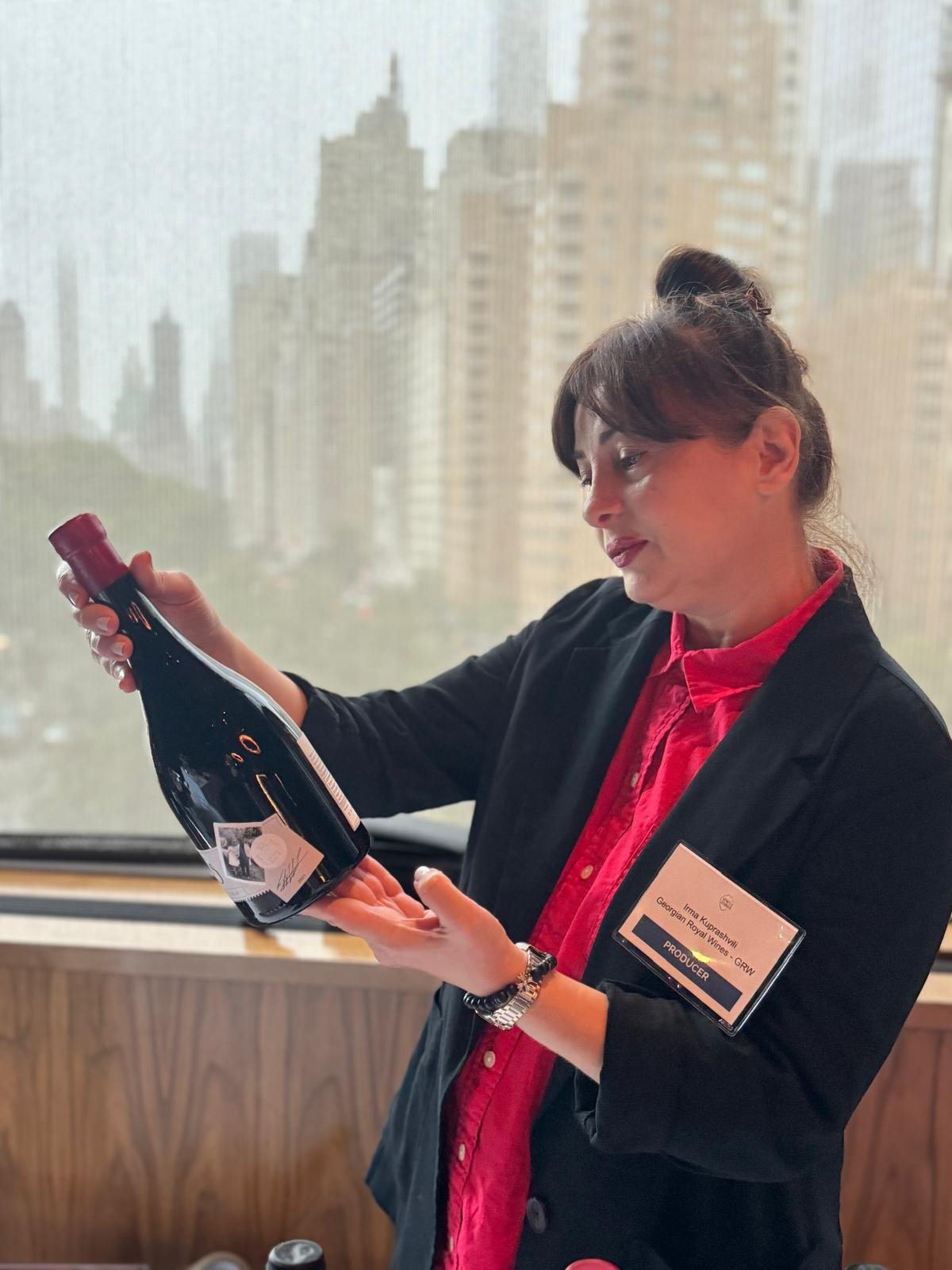 Irma pouring wine at the Wines of Georgia trade tasting in New York City